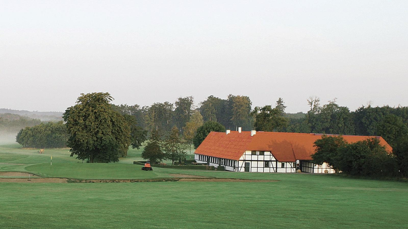 Green fields and half-timbered house of Falster Golf Club