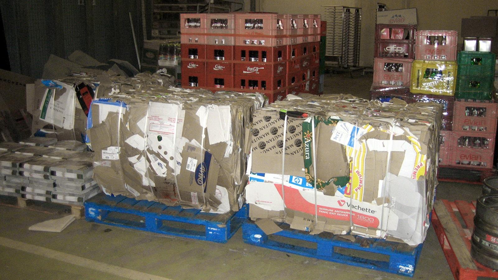 Cardboard bales and bottle crates in basement of Hilton Hotel